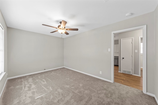 empty room featuring carpet and ceiling fan