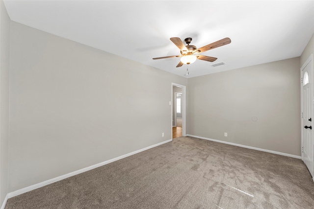 empty room with carpet flooring and ceiling fan