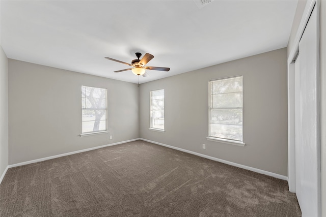 carpeted empty room with ceiling fan