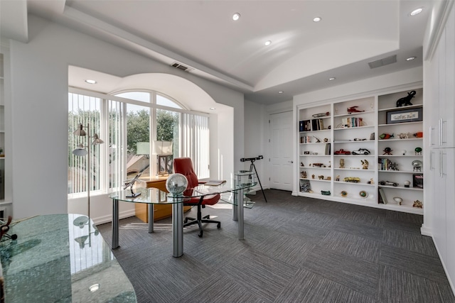 home office featuring recessed lighting, vaulted ceiling, dark colored carpet, built in shelves, and baseboards