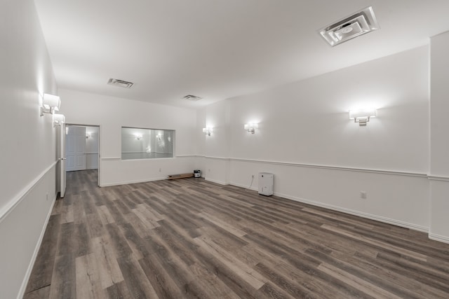 unfurnished room featuring dark hardwood / wood-style floors