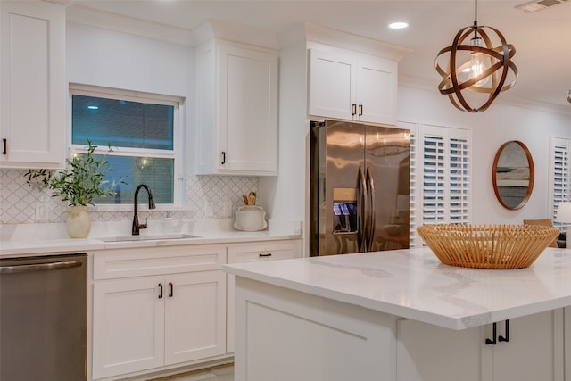 kitchen featuring backsplash, white cabinets, and appliances with stainless steel finishes