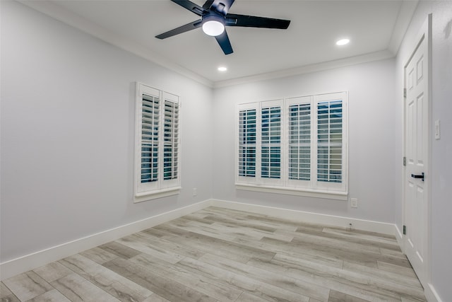 empty room featuring ceiling fan, light wood-type flooring, and crown molding