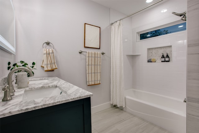 bathroom featuring vanity and shower / bathtub combination with curtain