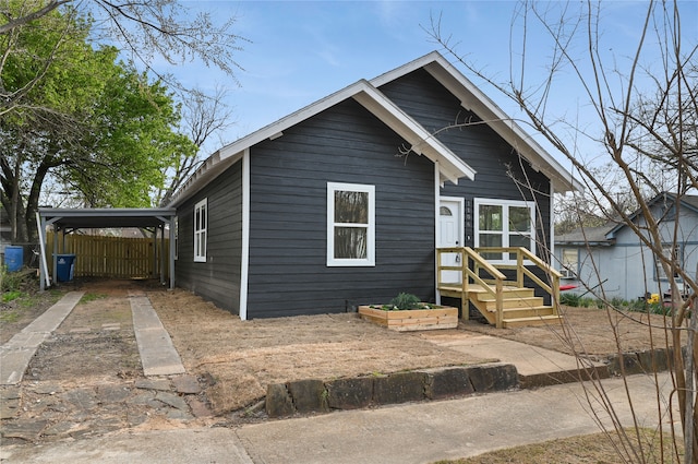 view of front of home featuring a carport