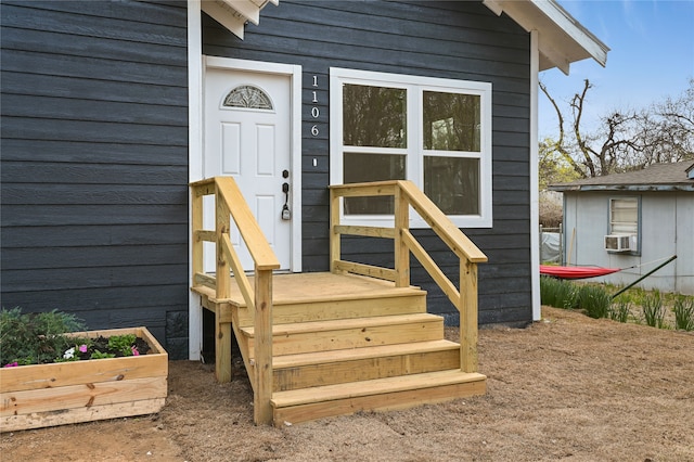 doorway to property with cooling unit