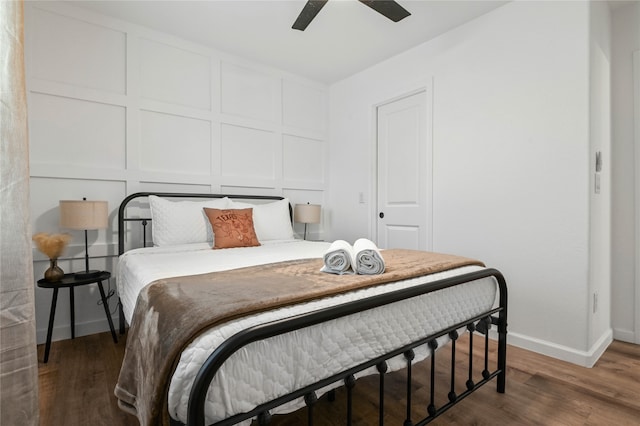 bedroom featuring ceiling fan and dark hardwood / wood-style floors