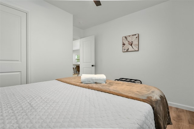 bedroom with wood-type flooring and ceiling fan