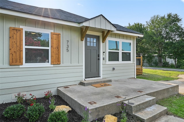 doorway to property featuring a yard