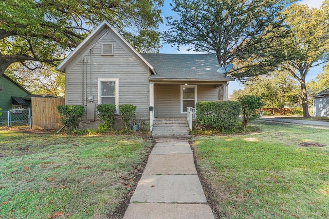 bungalow-style house featuring a front yard and a porch