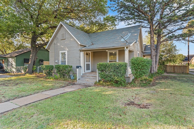 bungalow-style house featuring a front yard