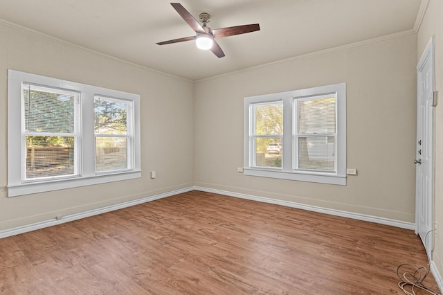 spare room featuring ornamental molding, light hardwood / wood-style floors, and ceiling fan