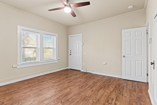 unfurnished room with ornamental molding, hardwood / wood-style flooring, and ceiling fan