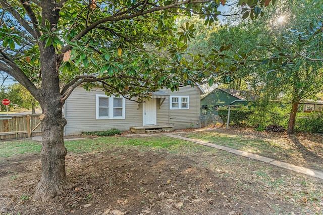 view of property hidden behind natural elements