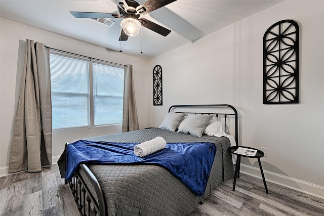 bedroom featuring hardwood / wood-style flooring and ceiling fan