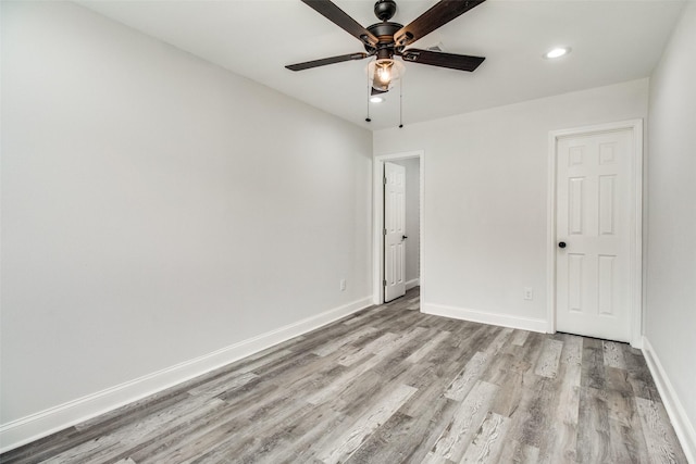 unfurnished room featuring light hardwood / wood-style flooring and ceiling fan