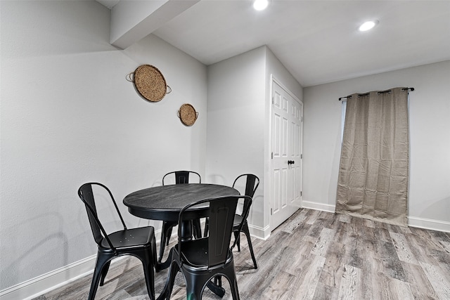 dining space featuring light wood-type flooring