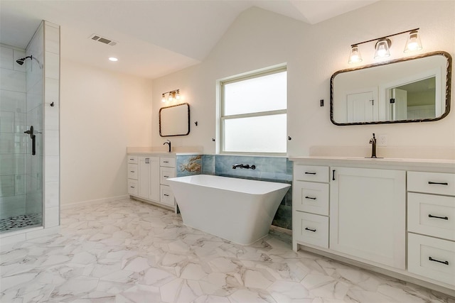 bathroom featuring vanity, lofted ceiling, and plus walk in shower