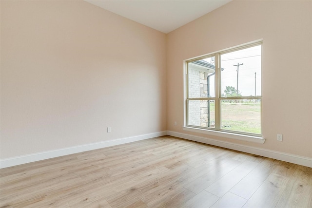 spare room with light wood-type flooring