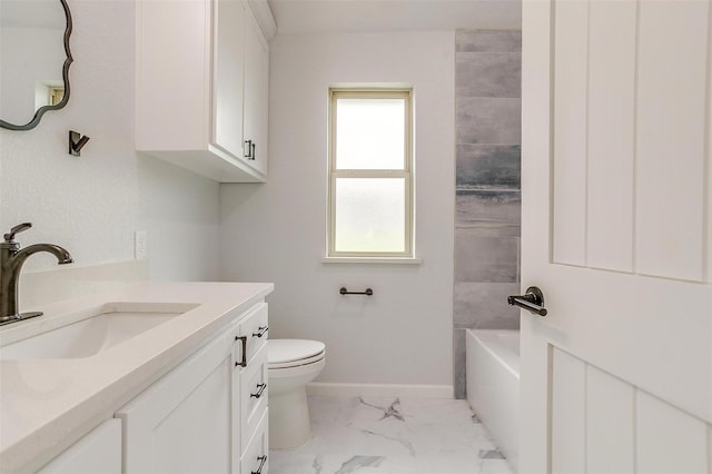 full bathroom with tiled shower / bath, vanity, and toilet