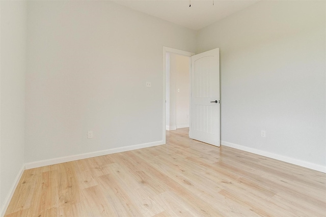 unfurnished room with light hardwood / wood-style flooring