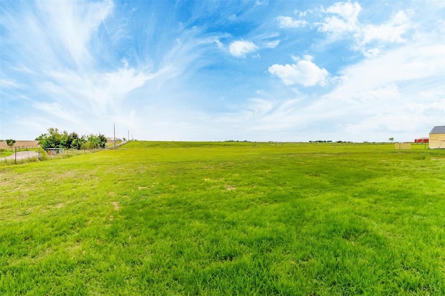 view of yard with a rural view