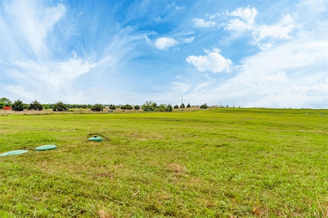 view of yard with a rural view