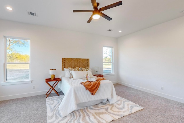 carpeted bedroom featuring ceiling fan