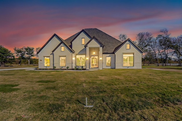 view of front of property with a lawn