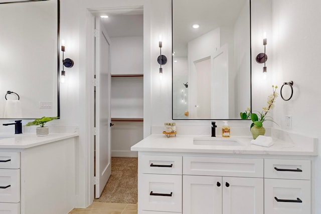 bathroom with vanity and tile patterned flooring