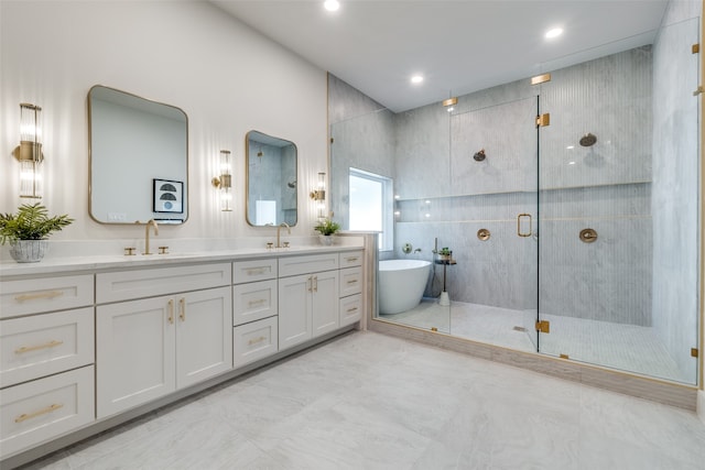 bathroom featuring vanity, separate shower and tub, and tile walls