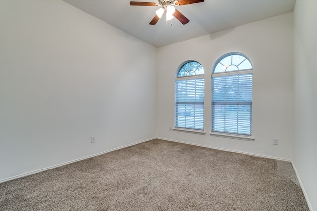 empty room featuring carpet and ceiling fan