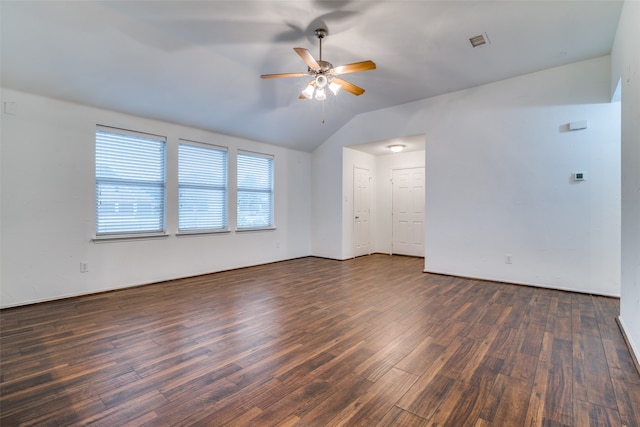 unfurnished room featuring lofted ceiling, dark hardwood / wood-style floors, and ceiling fan