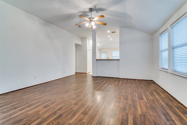 unfurnished living room with dark hardwood / wood-style flooring, lofted ceiling, and ceiling fan