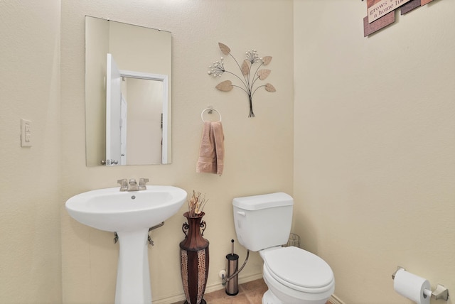 bathroom with sink and toilet