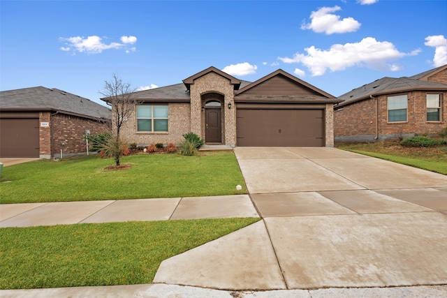 view of front of house with a garage and a front yard