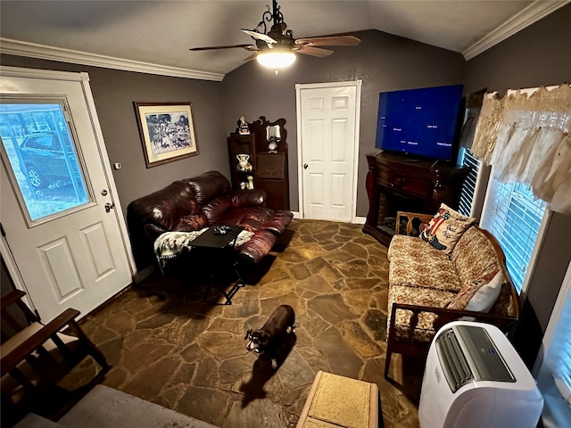 living room featuring ceiling fan, lofted ceiling, and ornamental molding