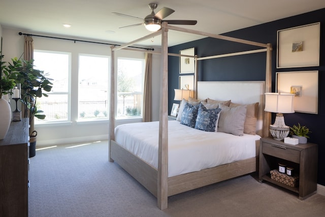 bedroom with ceiling fan and carpet floors