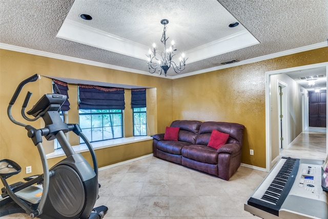 exercise room with a textured ceiling, a raised ceiling, crown molding, and an inviting chandelier