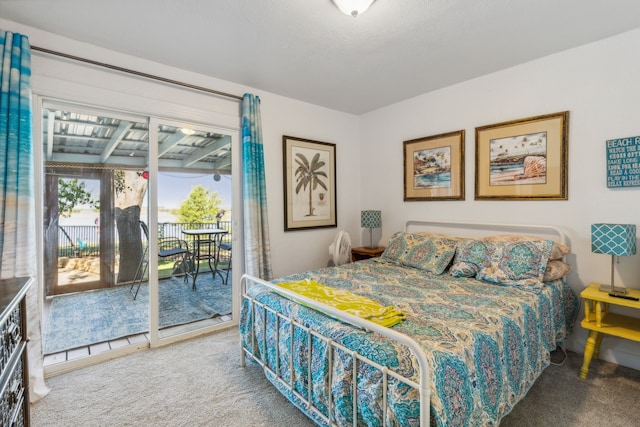 carpeted bedroom featuring access to exterior