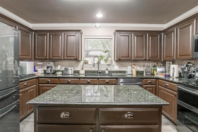 kitchen featuring a center island, beverage cooler, ornamental molding, and sink