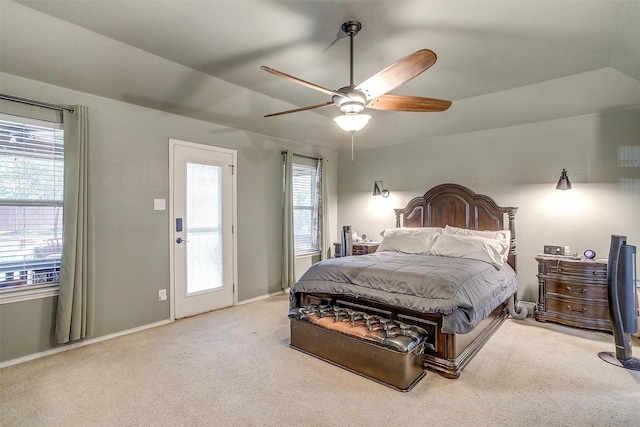 carpeted bedroom featuring ceiling fan and vaulted ceiling