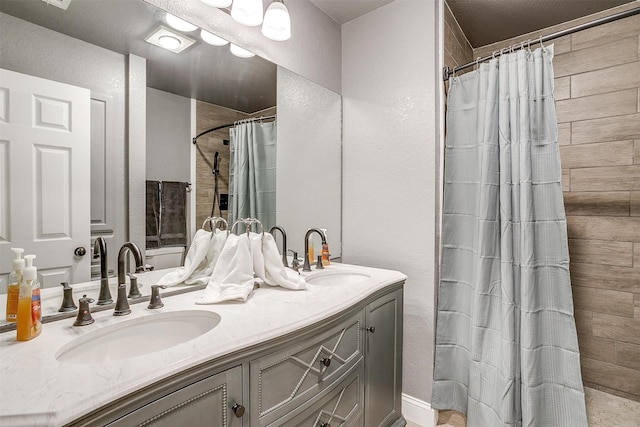 bathroom with vanity and curtained shower