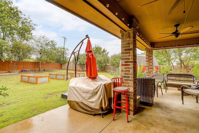 view of patio / terrace featuring area for grilling and ceiling fan