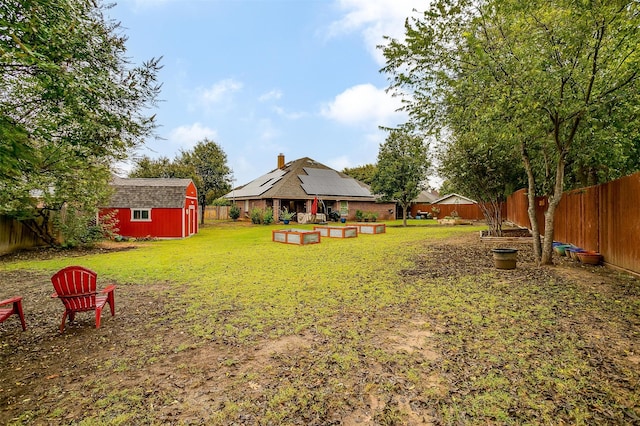 view of yard with a storage unit