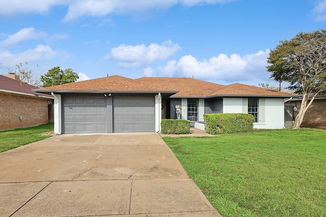 single story home featuring a garage and a front yard