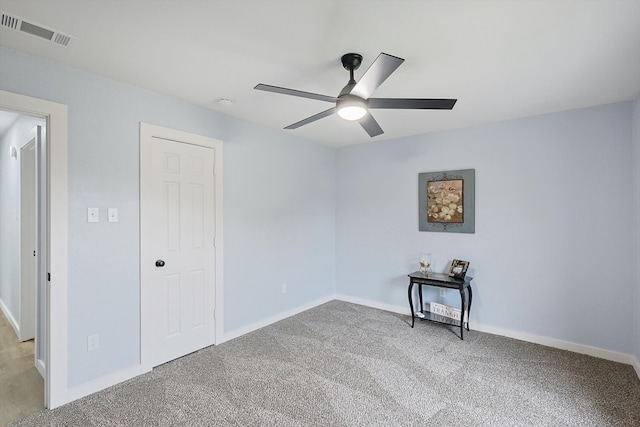 carpeted empty room with ceiling fan