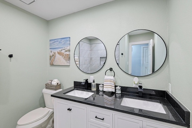 bathroom featuring toilet and vanity