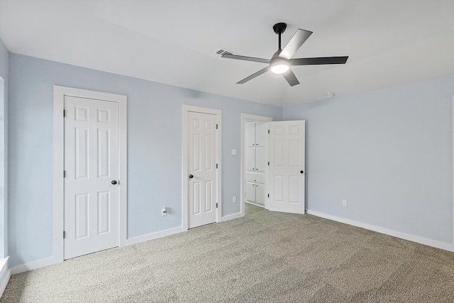 unfurnished bedroom with carpet flooring and ceiling fan