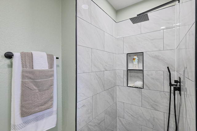 bathroom featuring tiled shower